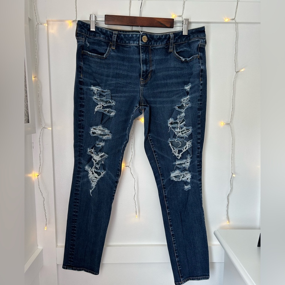 Dark blue American Eagle jeans with holes on both sides (super stretch)